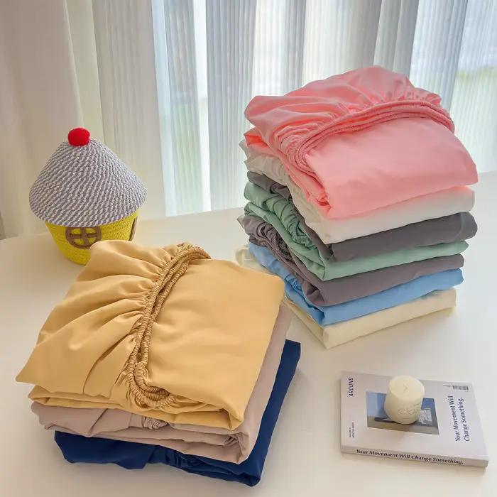 Drap-housse en coton avec bandes élastiques