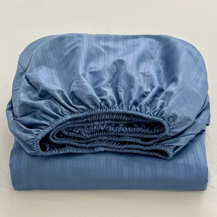 Drap-housse uni gaufré avec bande élastique