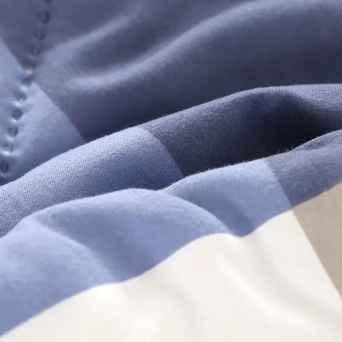 Une couverture de lit matelassée lavée de couleur unie printemps/été double