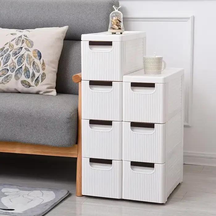 Petite armoire de sol d'angle de salle de bain blanche avec roulettes