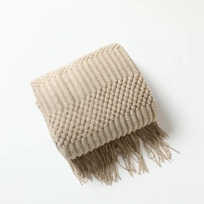 Couverture tricotée kaki avec glands